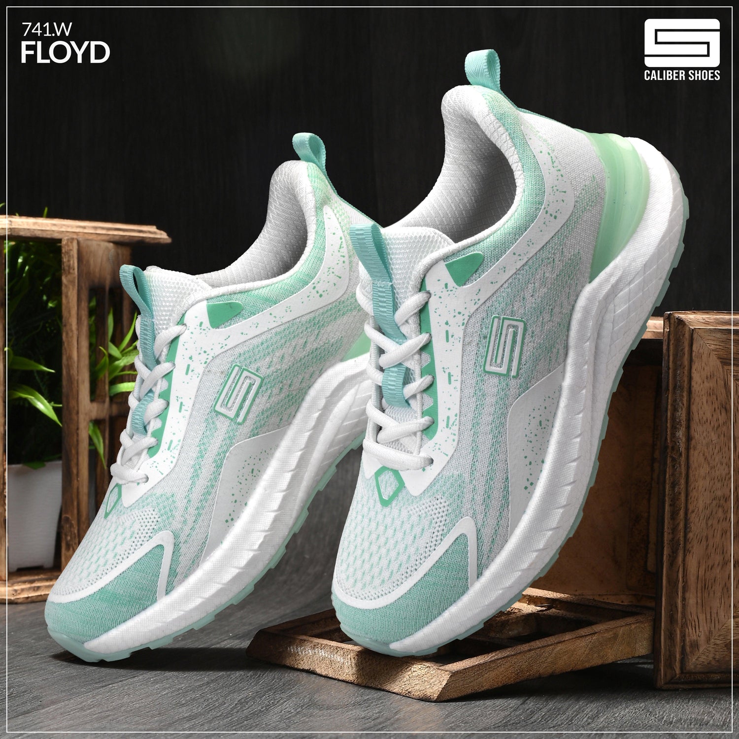 Stylish women's sports shoes in mint green and white, ideal for workouts and casual wear.