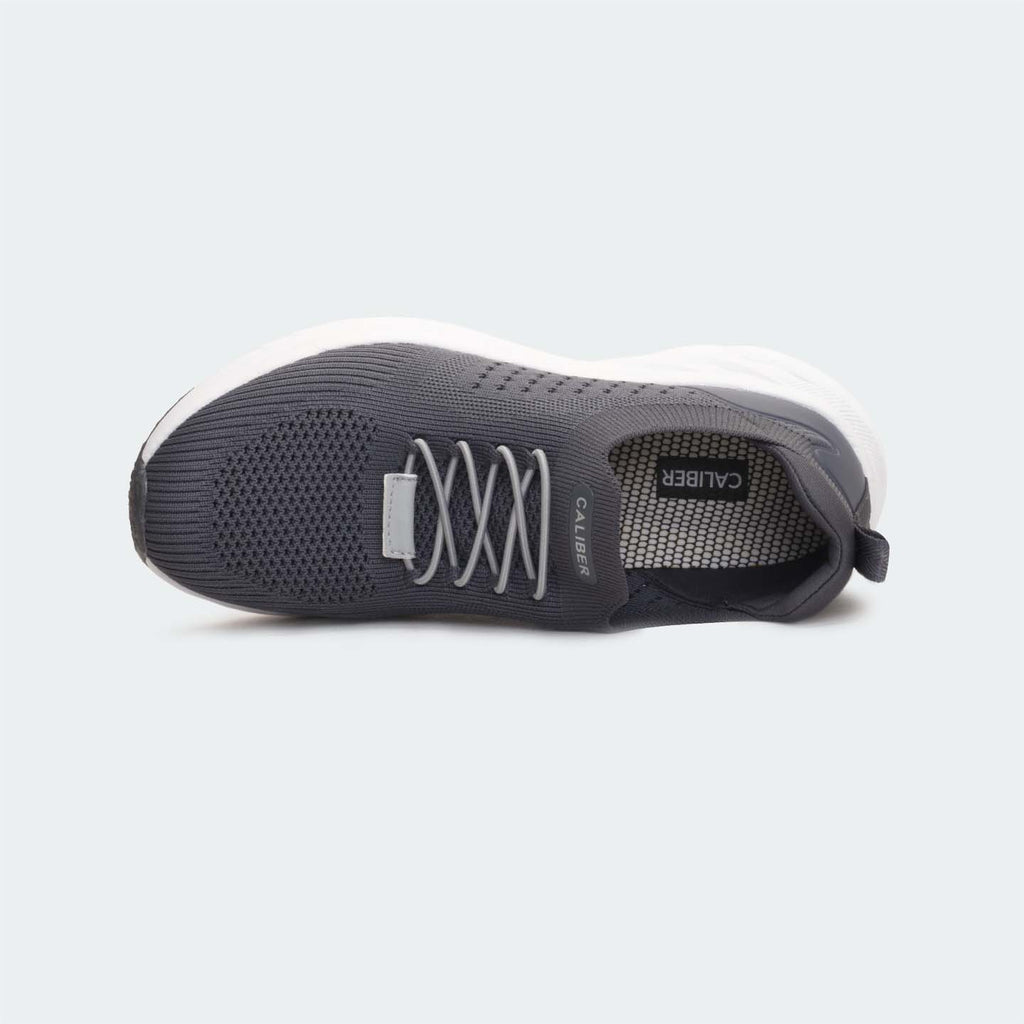 Grey sports shoes for unisex, featuring slip-on design and breathable engineered mesh upper.